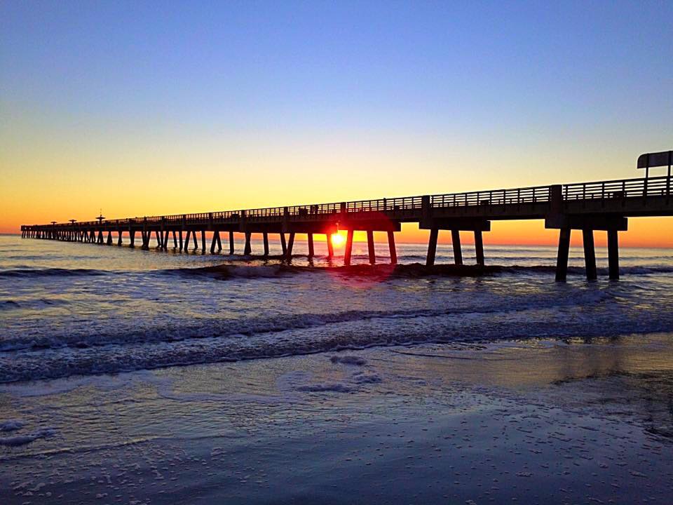 Jacksonville Beach pier at sunrise over the Atlantic