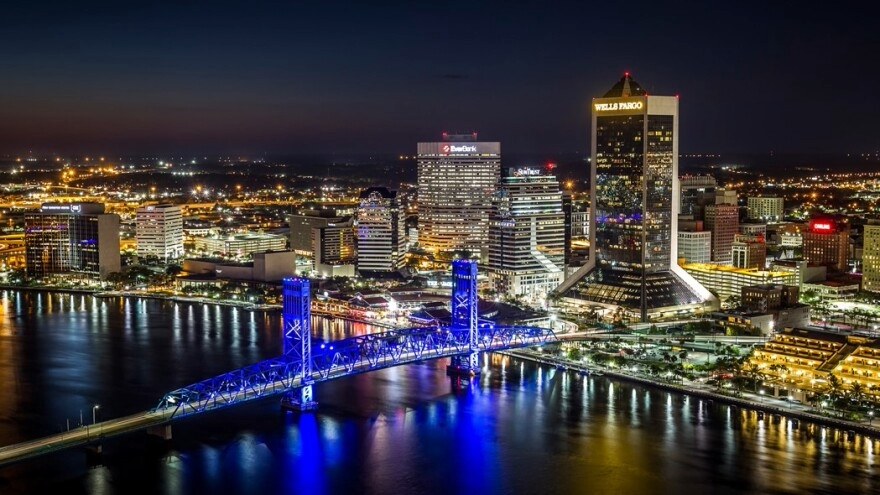 Downtown Jacksonville skyline and bridges over the St. Johns River at dusk